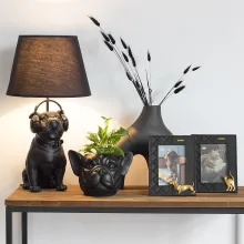 Schwarzer Bilderrahmen mit goldenem Dackelmotiv